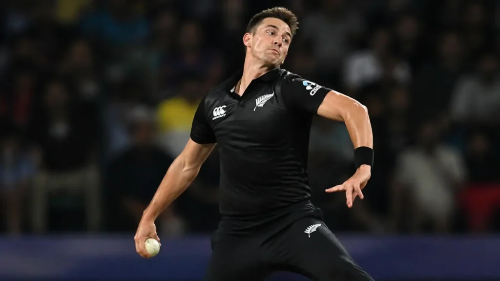 A fast bowler delivering a ball under stadium floodlights during an intense T20 match.
